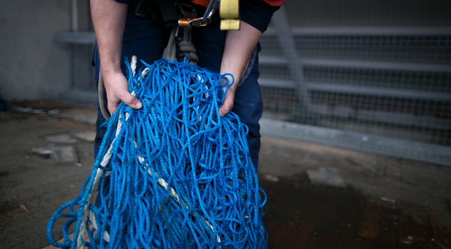 safety netting gathered in hands ready to be installed